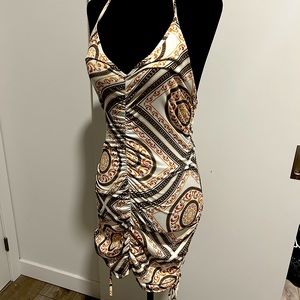Unique dress with a cool design and a low back. Size small. Fashion nova.